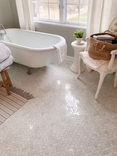 a white bath tub sitting next to a window