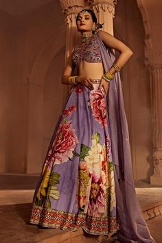 Lilac attached cancan lehenga with multi coloured floral motifs and intricate hand embroidery. Comes with padded, embroidered blouse with intricate thread and hand beadwork on the yoke and a co-ordinated dupatta.
Components: 3
Type Of Work: Floral
Neckline: Leaf
Sleeve Type: Sleeveless
Fabric: Lehenga and Blouse: Raw Silk, Dupatta: Georgette
Color: Purple,Multi Color
Other Details: 
Back tassel tie-up
Length:
Blouse: 14 inches
Lehenga: 44 inches
Model height: 5ft 8inches, wearing size S
Note: Al Cancan Lehenga, Lehenga And Blouse, Purple Lehenga, Leaf Sleeve, Floral Lehenga, Lehenga Blouse, Silk Dupatta, Bridal Set, Bridal Lehenga