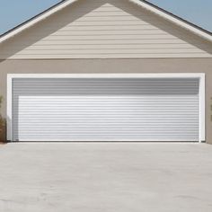 a white garage door in front of a house