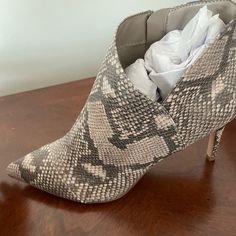 Fergalicious By Fergie Ankle Booties With Heel. Brand New And In Box. Never Worn. Very Pretty Snake Skin Pattern. Size 9. Pointed Toe Booties With Reinforced Heel In Synthetic Material, Synthetic Booties With Reinforced Heel And Pointed Toe, Synthetic Pointed Toe Booties With Reinforced Heel, Synthetic Ankle Boot Heels With 4-inch Heel, Casual High Heel Snake Print Boots, 4-inch Heel Synthetic Ankle Boots, Snake Print Heels With Pointed Toe, Snake Print Leather Heels Medium Width, Casual Snake Print Ankle-high Boots