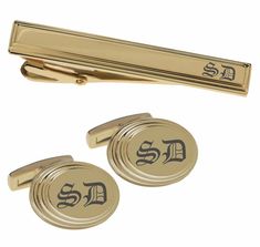 This gold cufflink & tie clip set can be custom engraved with names and dates or monogrammed with initials. These personalized cufflinks & tie clip have a beautiful high polished gold finish surrounded by a beveled edge frame to create a stylish accent to any cuffs. Our custom cufflink & tie clip sets make great personalized wedding gifts for your groomsmen and best man. All of our high quality cufflinks and tie clips are precision laser engraved by our expert team of engravers with a very quick turnaround time. Gold Beveled Edge Oval Cufflinks & Tie Clip Set Swivel back Cufflink Dimensions: 0.75" x 0.625" Tie Clip Dimensions: 2.125" x 0.3" Black Gift Box Included How To Send Engraving Instructions: When you are ready to order click ADD TO CART.  During checkout fill out the ADD A NOTE sec Gold Suit And Tie Accessories For Father's Day, Father's Day Engraved Gold Cufflinks, Father's Day Gold Engraved Cufflinks, Classic Gold Cufflinks For Wedding Gift, Classic Gold Suit And Tie Accessories, Classic Gold Cufflinks With Initials, Elegant Customizable Gold Cufflinks, Elegant Gold Customizable Cufflinks, Wedding Gifts Groomsmen