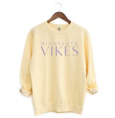 The perfect cozy sweatshirt for Vikings Football games! Product Details: * Relaxed fit, medium-heavy fabric * 80% ring-spun cotton, 20% polyester * Color: Butter * Unisex Fit; Please refer to the sizing chart in the listing photos to find your perfect fit! Care Details: * To maintain the quality of your sweatshirt, wash inside out on a delicate cycle and in cold water * Hang dry or lay flat to dry Shipping Details: * This product is made especially for you as soon as you place an order, which is why it takes a bit longer to deliver it to you.  * Please allow 1-2 weeks for processing, thank you! Comfortable Fleece Sweats With Letter Print, Fall Fleece Sweatshirt With Screen Print, Relaxed Fit Sweats With Letter Print, Comfortable Letter Print Sweats With Relaxed Fit, Relaxed Fit Letter Print Comfy Sweats, Cozy Cotton Crew Neck Tops, Yellow Long Sleeve Relaxed Fit Sweatshirt, Comfy Sweats With Letter Print In Relaxed Fit, Comfy Sweats With Letter Print And Relaxed Fit