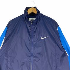 PLEASE ASK ANY QUESTION BEFORE BUYING THIS IS USED CLOTHING PLEASE DONT EXPECTED IT TO BE LIKE NEW OR IN PRISTINE CONDITION Vintage 90s NIKE Windbreaker Light Zip Jacket tag Nike material Polyester 100% saiz on tag M (Medium) Mesasures About ( Approximately) -Armpit to Ampit : 24.5 inch -Length (back collar down) : 27 inch Condition : used good condition 8/10 **No Tears No Stains And No Hole** 🎈PLEASE READ THE DESCRIPTION AND POLICY BEFORE BUYING 🎈ACCEPT PAYMENT: PAYPAL ONLY ALL ITEM WILL BE S Navy Sportswear Track Jacket For Streetwear, Navy Sportswear Windbreaker For Sports, 90s Blue Sports Outerwear, 90s Style Blue Sports Outerwear, Navy Athleisure Windbreaker For Streetwear, Blue Winter Training Outerwear, Blue Sportswear Windbreaker For Streetwear, Blue Sportswear Windbreaker, Sporty Navy Windbreaker For Streetwear