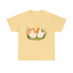 a yellow t - shirt with three chickens on the front and one chicken in the back