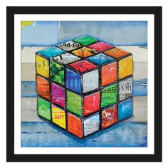 a painting of a rubik cube made out of different types of paint and paper