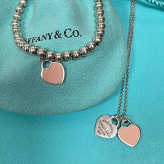 Tiffany & Co Pink Enamel Return To Tiffany Heart Necklace And Bracelet In 925 The Set Is In Preowned Condition And It Will Be Professionally Polished And Clean Prior To Shipment. Your Purchase Includes One Tiffany Pouch And A Box. The Bracelet Measures 7” Long With An Approx 0.39”X0.46” Heart The Necklace Measures 17” Long With An Approx 0.39”X0.46” Heart. Igm L3 Luxury Sterling Silver Bracelets For Valentine's Day, Classic Sterling Silver Heart Bracelet For Valentine's Day, Luxury Silver Bracelets For Valentine's Day, Luxury Sterling Silver Heart Bracelet For Anniversary, Sterling Silver Heart Pendant Bracelet In White Gold, White Gold Sterling Silver Heart Pendant Bracelet, Luxury Sterling Silver Heart Bracelet For Gift, Luxury Sterling Silver Heart Bracelet For Valentine's Day, Luxury Silver Heart Bracelet For Valentine's Day