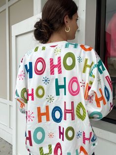 Spice up your holiday outfits with our HoHoHoliday Printed Crewneck! Made with festive prints and sparkly rhinestone detailing, this crewneck adds a touch of fun and glam to any look. (Just don't wear it to your office holiday party - unless you want to steal the show!) Multicolor Tops For Holiday In Fall, Multicolor Tops For Holiday Fall Season, Multicolor Printed Holiday Tops, Multicolor Tops For Fall Holiday, Multicolor Printed Tops For Holiday, Multicolor Festive Tops For Fall, Holiday Multicolor Graphic Print Tops, Multicolor Graphic Print Holiday Tops, Multicolor Crew Neck Christmas Top