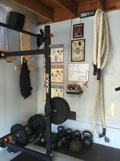 there is a gym room with various equipment on the wall