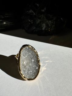 Perfectly sized and sparkling this grey quartz from Uruguay is sure to be a quick staple in any jewelry collection. This ring is 26mm x 16mm and is on a fully adjustable hammered ring band Grey Quartz, Hammered Ring, Outfit Maker, Quartz Ring, Ring Band, Ring Collections, Ring Bracelet, Band Rings, Solid Gold