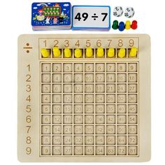 a wooden board with numbers and dices on it's side, next to an eraser