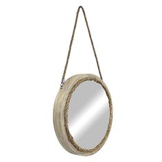 a round mirror hanging on a rope