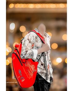 a mannequin holding a red bag in his hands