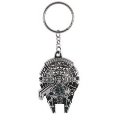 a metal keychain with a star wars millennium falcon on it's side