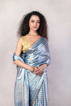 Blue Handwoven Striped Pure Katan Silk Mashru Banarasi Saree Elegant Blue Pre-draped Saree For Puja, Blue Katan Silk Pre-draped Saree With Zari Work, Elegant Blue Pre-draped Saree With Zari Weaving, Blue Katan Silk Pre-draped Saree, Blue Wedding Pre-draped Saree With Zari Weaving, Elegant Blue Banarasi Silk Pre-draped Saree, Blue Banarasi Silk Pre-draped Saree With Unstitched Blouse, Designer Blue Pre-draped Saree With Zari Weaving, Designer Transitional Blue Saree