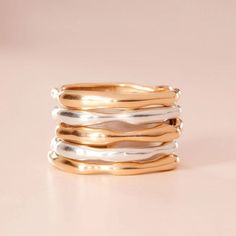 A stack of chunky rings alternating between silver and gold. The rings look like molten metal or strings of paint. They lie on a pale pink background. Catbird Jewelry, Gold Stacking Ring, Ring Stack, Gold Ring Stack, Recycled Gold, Gifts For Wedding Party, Engagement Ring Wedding Band, Stacking Ring, Ring Silver