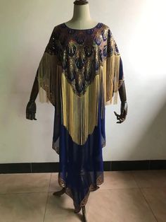 Experience the embodiment of timeless African elegance with our Dashiki Abaya, a true masterpiece meticulously designed to celebrate cultural richness and contemporary style. Crafted with the utmost care and attention to detail, this attire is a harmonious blend of tradition and modernity, making it the ideal choice for women who appreciate the beauty of African heritage and fashion-forward aesthetics. Chiffon Fabric: Our Dashiki Abaya is crafted from soft and breathable chiffon fabric, which of Nigeria Clothes, Dashiki Fashion, Africa Clothing, Abaya Design, African Dashiki, Sequins Dress, Abaya Designs, Sequin Maxi Dress, African Heritage