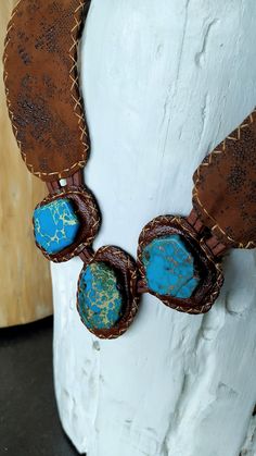 Stunning necklace handcrafted with caramel leather and Turquoise Jasper stones slabs. The leather has a beautiful texture that makes the difference and highlights the pieces. Totally stitched by hand. This necklace is gorgeous and sophisticated. **IMPORTANT TO KNOW: The piece is one of a kind, that it means, that isn't another piece like that. This is what I love to do: unique pieces for exigent women. THE BRACELET WAS SOLD!! **ABOUT THE NATURAL STONES: This jewelry was handmade with naturals ge Artisan Turquoise Stone Necklace, Handmade Adjustable Vintage Turquoise Necklace, Artisan Adjustable Turquoise Gemstone Necklace, Artisan Brown Turquoise Necklace For Jewelry Making, Bohemian Brown Turquoise Necklace For Jewelry Making, Rustic Turquoise Necklace With Natural Stones For Gift, Handmade Adjustable Southwestern Turquoise Necklace, Handmade Southwestern Adjustable Turquoise Necklace, Southwestern Turquoise Leather Jewelry