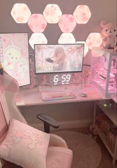 a pink chair sitting in front of a computer desk