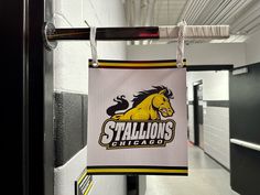 a sign hanging from the side of a building that says stallions chicago on it