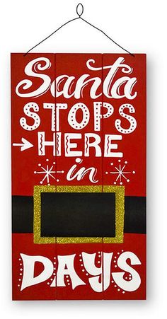 a sign that says santa stops here at days