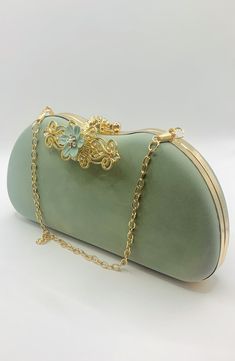 Stunning Sage Green Flower Embellished Bridal Wedding Clutch Bag with Gold Chain  Soft Velvet Style Finish Simply Beautiful Wedding Clutch Bag with Two Gold Chains, One for Short and One for the Shoulder  Very Elegant Perfect Wedding Day Clutch Bag  Co-ordinating Shoes Also Available  Size Approx. 22.5cm x 11.5cm x 4cm Flower Shaped Evening Bag, Elegant Flower-shaped Evening Bag, Formal Flower-shaped Evening Bag, Elegant Flower-shaped Party Bags, Elegant Flower-shaped Evening Bag For Events, Elegant Flower Shaped Evening Bag For Events, Elegant Flower Shaped Evening Bag, Elegant Flower Clutch For Party, Elegant Flower Shaped Clutch For Formal Occasions