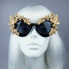 Hand-decorated black & gold filigree ornate sunglasses featuring Ganesh. Please note: There is no ready-made sunglasses box large enough for these sunglasses. These sunglasses are wearable art and need to be treated with due care. While i have taken every possible care to make them sturdy throwing them in a bag careless may damage them. Treat them as you would a precious thing... Approx measurements: Inner arm to arm: 13cm Total width: 16cm Approx Weight: 42g Thank you in advance for not PM' Gold Mirrored Sunglasses For Evening, Gold Cat Eye Sunglasses With Mirrored Lenses For Party, Gold Mirrored Cat Eye Sunglasses For Party, Gold Mirrored Lenses Cat Eye Sunglasses For Party, Luxury Gold Cat Eye Sunglasses For Party, Elegant Gold Cat Eye Sunglasses With Tinted Lenses, Gold Sunglasses For Summer Festival, Gold Sunglasses With Gradient Lenses For Festivals, Gold Tinted Sunglasses For Festival