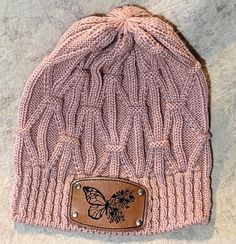 pink knit style hat butterfly with 1 floral wing Leatherette Patch and Attached with Rivets. Pink Spring Beanie One Size, Pink One Size Beanie For Spring, Pink Spring Beanie Cap, Casual Pink Beanie For Spring, Trendy Pink Beanie For Spring, Trendy Pink Beanie, Trendy Adjustable Pink Beanie, Fitted Spring Beanie Cap, Fitted Beanie For Spring