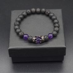 Materials Natural Amethyst &Lava beads  Cubic Zirconia Crown charm BRACELET SIZE - WRIST SIZE: Please select your actual "wrist size" (not the size you think the bracelet should be) in the dropdown menu and I will make sure the bracelet fits your wrist. Your wrist size is the actual wrist measurement in the location where you will be wearing your bracelet. The measurement is in inches. How to Measure: Measure your wrist with a tape measure or a piece of string. Add ¼ inch for a snug fit or Add ½