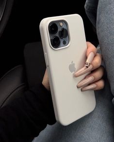 a woman's hand holding an apple phone case