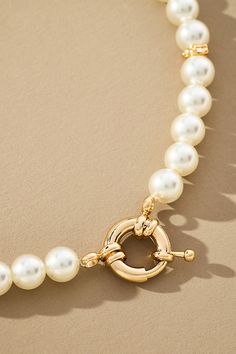 This only-at-Anthro necklace features pearl beads, finished with a circular clasp to customize with the charms of your choosing. Made with 14k, 18k, and 24k plated gold, this only-at-Anthro collection is designed with everyday wear in mind. Whether working out, running errands, or heading to dinner, these made-to-last pieces add a glimmer of luxury to every look. Pearl Charm Necklace in White, Women's, Gold/Plated Brass/Glass Trendy Pearl Necklace, Styling Pearls, Bead Figures, Pearl Necklace Layering, Gold Pearl Jewelry, Pearl Charm Necklace, Cute Necklaces, Chunky Pearls, Preppy Jewelry