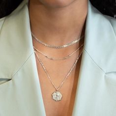 This necklace features a Sterling Silver coin pendant on a Figaro chain. Layer with necklaces from our Patented O collection. Pendant Diameter 0.6in (1.5cm) Figaro chain, 2mm Adjustable chain: 17-19in (44-48cm) When layered, chain length is: 17-21in (44-53cm) Learn more Sterling Silver Spring clasp closure Hypoallergenic, lead and nickel free #290S Layer Necklaces, Jewelry Gift Guide, Layered Chain, Hoop Charms, Moms Bracelet, Choker Pendant, Studded Necklace, Gold Statement Ring, Nose Jewelry