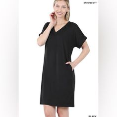 Stay Comfortable And Stylish With Our T-Shirt Dress By Zenana. Made With The Best Quality Brushed Fabric, This Dress Is Buttery Soft And Offers A Flattering V-Neck Design With Rolled Short Sleeves. Plus, It Even Has Pockets! Perfect For Busy Women On The Go. Details: V Neck Rolled Sleeve Relaxed Fit Pockets 90% Polyester 10% Spandex True To Size Black T-shirt Dress For Loungewear, Casual Black Mini Dress For Loungewear, Black Casual Mini Dress With Relaxed Fit, Black Relaxed Fit Mini Dress Casual, Black Relaxed Fit Casual Mini Dress, Black T-shirt Dress For Day Out In Spring, Black Relaxed Fit Dress For Loungewear, Black Short Sleeve T-shirt Dress For Day Out, Black Tshirt Dress