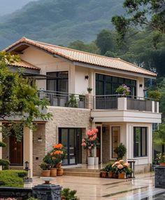 a large house with lots of windows and plants