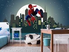 a bedroom with a spiderman mural on the wall and a soccer ball in the foreground