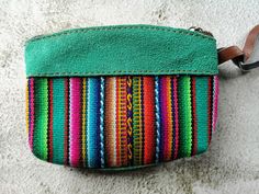 ☀️ 🦙 🌈 If you like vivid colors evoking vibrant Latin style, these one is a perfect choice! Multi colored Peruvian purse made locally with unique traditional hand loomed Cuzco textiles enriched by decoration associated with South American symbolic.   This cute little real leather purse is perfect for holding your cards, coins and other little things. It comes in five different colors. The natural properties of the leather means this purse will age and darken to develop its own unique hint over time.  Chemical dyes have not been used and the natural colors of the hide vary.  The leather is naturally dyed so each bag has its own unique natural color, making them the unique gift you can buy!      * Size 13cm x 10cm  If you have any question don't hesitate to contact me! Bohemian Multicolor Coin Purse For Daily Use, Multicolor Woven Pouch For Everyday Use, Handmade Multicolor Coin Purse For Travel, Handmade Multicolor Coin Purse, Handmade Multicolor Coin Purse For Everyday Use, Handmade Green Coin Purse For Travel, Traditional Multicolor Wallet For Everyday Use, Handmade Green Wallets For Everyday, Traditional Multicolor Wallet