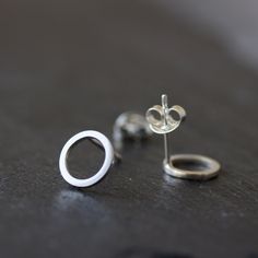 "These minimalistic stud earrings are full of tenderness and eternal beauty. They ideally pass to your outfit, no matter what style you prefer. These studs are perfect for everyday use, they are so lightweight, that you'll never feel them. The earrings are made of sterling silver. The diameter of the circle is approx. 6 mm (1/4\"). The earrings are made to order, the production time is up to 5 days. You will receive them gift wrapped for no additional charge." Minimalist Pierced Open Circle Jewelry, Modern Tiny Earrings For Everyday, Minimalist Pierced Open Circle Earrings, Minimalist Open Circle Pierced Earrings, Tiny Minimalist Sterling Silver Earrings, Minimalist Sterling Silver Earrings For Everyday, Minimalist Tiny Earrings For Everyday, Minimalist Nickel-free White Gold Earrings, Tiny Minimalist Everyday Earrings