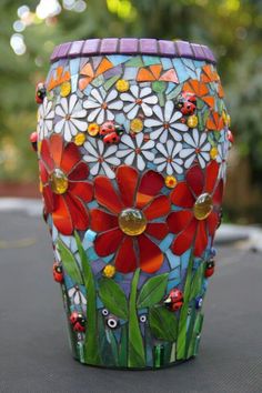 a colorful vase sitting on top of a table