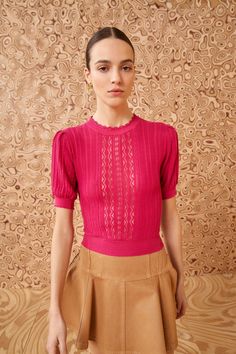 Made from the most delicate silk and cotton, our Gemma Top is an antique-inspired lovely arriving in our new geometric pointelle knit. Splashed a vivid orchid pink, it has gently puffed sleeves, a cropped fit, and is slightly stretchy. It styles perfectly with our beloved denim, skirts, and tailored separates. Composition: 60% Silk, 40% Cotton Pair with our Vera Skirt to complete the look. Elegant Fitted Pink Knit Top, Fitted Textured Knit Blouse For Spring, Pink Fitted Fine Knit Top, Elegant Short Sleeve Pointelle Knit Top, Chic Pink Pointelle Knit Top, Pink Fitted Cropped Knit Top, Spring Pink Pointelle Knit Tops, Fitted Pink Textured Knit Top, Fitted Pink Cropped Knit Top