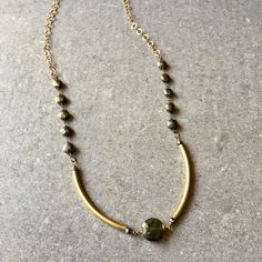 This handmade Pyrite and Quartz necklace has a unique design with brass tubes and gold chain that compliment the natural stones so well. Handmade OOAK vintage artisan piece of jewelry that's elegant but also everyday not too bling bling but subtle and natural look and style that goes well with any outfit. For my own jewelry designs please visit my 3 other Etsy shops: LeatheRCycle.etsy.com QuirkyCreatures.etsy.com DotsAttack.etsy.com **I have three more shops here on Etsy filled with my own art work and jewelry designs. Please visit: *https://www.LeatheRCycle.etsy.com *https://www.QuirkyCreatures.etsy.com *https://www.DotsAttack.etsy.com And please follow me on Instagram and facebook @quirkycreatures and @leathercyclejewelry Quartz Necklace, Grey And Gold, Schmuck Design, Quartz Stone, Jewelry Designs, Bling Bling, Stone Necklace, Gold Chain, Gold Chains