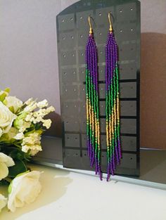 bead earrings, purple  long earrings, extra long earrings, fringe earrings, boho earrings, seed bead earrings, handmade earrings Add a pop of vibrant color and boho flair to your look with these gorgeous handmade purple fringe bead earrings! These extra long earrings feature a stylish seed bead design that adds a fun and playful touch to any outfit. Perfect for making a statement and showcasing your unique style, these boho earrings are a must-have accessory for any jewelry lover. Elevate your a Purple Fringe, Trendy Fringe, Extra Long Earrings, Earrings Purple, Seed Bead Earrings, Earrings Boho, Czech Beads, Fringe Earrings, Bead Earrings