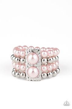 Held in place with a hammered silver frame dotted with two oversized pink pearls, strands of classic silver and pearly pink beads are threaded along stretchy bands around the wrist for a glamorously layered look.

 Sold as one individual bracelet. Pink Pearl Bracelet, Pink Pearls, Paparazzi Accessories, Stretchy Bracelets, White Rhinestone, Pink Beads, Paparazzi Jewelry, Pink Bracelet, Hammered Silver