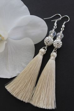 Wedding Tassel earrings, Silk tassel earrings, Bohemian earrings, Modern earrings, Bridal jewelry Earrings are light-weight and made with silk tassel, rhinestone, crystal. These earrings are 3.5 inches ( 8.5 cm) long without the hook. Please select your color from the drop-down menu. ------ SHIPPING & DELIVERY TIMES All items are dispatched from Poland. Delivery time varies depending on your country and shipping method. ------  STANDARD SHIPPING: (registered air mail): Europe: 3 to 8 business da Art Deco Wedding Theme, Chistmas Gift, White Tassel Earrings, Wedding Earrings Chandelier, Knit Boot Socks, Bridal Jewellery Earrings, Earrings Chandelier, White Tassel, Earrings Bohemian