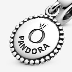 An elegant way to wear the logo trend, it's stamped with our brand name and crown O monogram making it the perfect piece for Pandora lovers. You can also try wearing it as a necklace pendant, displaying the front or back to suit your mood. - Pandora Icon Dangle Charm - Sterling silver Silver Charms For Everyday, Elegant Silver Charms For Everyday, Silver Jewelry With Logo Charm For Anniversary, Anniversary Silver Jewelry With Logo Charm, Everyday Silver Jewelry With Logo Charm, Classic Silver Jewelry With Crown Design, Classic Charms For Everyday, Classic Sterling Silver Jewelry With Crown Design, Classic Personalized Silver Charms