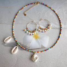 Rainbow earrings, colorful earrings, beach jewelry, big hoop earrings, modern jewelry, mothers day gift, freshwater pearl hoop earrings, wire wrapped earrings, cute earrings, summer jewelry, unique earrings, rainbow jewelry, 24K gold filled hoop. Modern trendy beach jewelry. These rainbow earrings look like a piece you might pick up on vacation. Wear them with everything from a T-shirt and jeans to your favorite swimsuit. HIGH QUALITY MATERIALS / SIZE 24-karat gold filled 20mm hoops wire wrapped Colorful Hoop Earrings For The Beach, Colorful Handmade Hoop Earrings For Beach, Colorful Bohemian Hoop Earrings For The Beach, Handmade Rainbow Hoop Earrings For The Beach, Seed Bead Choker, Jewelry Big, Earrings Beach, Surfer Necklace, Trendy Beach