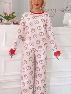 The Wreath Love Pink PJ Set from Sassy Shortcake is super soft and comfy to lounge around! They feature an adorable Christmas wreath design all over. The bottoms feature an elastic waistband. Made from soft brushed cotton. fit: runs true to size, model wearing size xsmall care: hand wash cold Cute Pink Sleepwear For Holiday, Casual Christmas Sleepwear With Elastic Waistband, Pink Cotton Christmas Sleepwear, Pink Cotton Sleepwear For Holiday, Cozy Christmas Loungewear Bottoms, Pink Pj Set, Christmas Pj Set, Sassy Shortcake, Christmas Pj