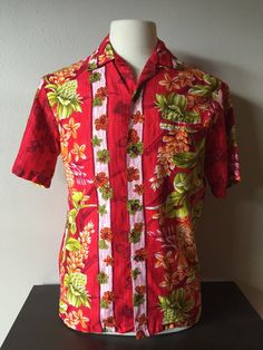 1950s  Diamond Head Sportswear Waikiki Hawaiian Shirt Cotton Sheen Red/Green/Orange Metal Buttons Single Invisible Chest Pocket Loop Collar Please compare measurements to your own shirt for true fit Size - Vintage Medium Mannequin Size Reference, 38" / 35" / 41"  Laid Flat Measurements across front,  double chest, waist, hip measurements Chest - 20 1/2" Waist - 19 1/2" Hips - 19 1/2" Neck to Shoulder - 6 1/2" Sleeve Length - 10" Front Length (neck to hem) - 24 1/2" Back Shoulder Width - 17" Fabric - 100% Cotton Condition - Excellent to Mint Vintage Thank Youfor being 'retrocorrect' *Reminder Note Please keep in mind, all of my items are 100% authentic vintage. This means they are not new and may show natural signs of wear and age. I do my very best to make note of any and all flaws in the Tropic Thunder, 1950s Shirts, Diamond Head, Vintage Hawaii, 50s Vintage, Luau Party, Vintage Hawaiian, Hawaiian Shirts, Boho Floral