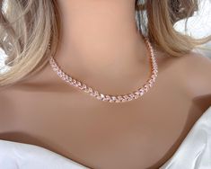 crystal bridal necklace set: necklace, bracelet and earrings.  Gorgeous bridal or bridesmaids jewelry set for your wedding day!   This wedding jewelry set is available in silver, gold or pink gold(rose gold) color to match your dress.   Necklace measures about 16.5" long. Extensions are available to make it longer. Just contact me, please. Earrings are about 1 1/2" long and 1/2" wide. Matching regular bracelet is measuring: 7" long and 1/4" wide or an adjustable bolo matching bracelet is available as well. High quality guaranteed by GlamourBrideUSA! SHIPPING: Standard Shipping: 4-6 business days Priority mail Shipping: 2-3 business days *INTERNATIONAL ORDERS: PLEASE NOTE CUSTOMERS ARE RESPONSIBLE FOR ALL DUTIES & TAXES* Rose Gold Cubic Zirconia Bridal Necklace For Anniversary, Rose Gold Cubic Zirconia Jewelry For Wedding, Delicate Rose Gold Cubic Zirconia Bridal Necklace, Rose Gold Crystal Jewelry For Wedding, Rose Gold Crystal Necklaces For Wedding, Rose Gold Crystal Bridal Necklace Gift, Rose Gold Crystal Jewelry For Bridesmaids, Rose Gold Crystal Bridal Necklace, Dainty Rose Gold Bridal Necklace For Anniversary