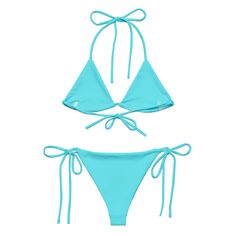 boxedcat ICE ICE BABY Bikini Embrace the sun, sand, and sea with our stunning vibrant blue bikini. Each curve-hugging piece promises not just a fashion statement but a commitment to our planet. Not only are these designs exclusive to boxedcat, there are multiple ways to tie this top to create a look that's as unique as you are. Say goodbye to tan lines and hello to your perfect beach look. Experience the caress of our soft, stretchy fabric that is double layered for quality and provides UPF 50+ Adjustable Triangle Top Swimwear, Adjustable Solid Swimwear For Sunbathing, Solid Color Swimwear For Beach Season, Adjustable Solid Color Swimwear For Poolside, Solid Swimwear For Beach Season Swimming, Adjustable Solid Swimwear For Poolside, Uv Protection Triangle Top Swimwear For Beach Party, Solid Color Beachy Swimwear For Pool, Beachy Solid Color Swimwear For Pool