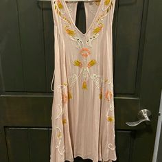 Blush Pink Dress From Free People Intimately. Tank Top Design. V-Neckline. Embroidered Eyelet Detailing. Lace Up Sides On The Back With Tasseled Ends. Button Loop Back Closure With Keyhole. Shift Dress. Mini Style/Above The Knee Length. Boho Style. Relaxed, Flowy, Comfortable Fit. Made Of 100% Rayon. New With Tags Size Xsmall Length- 34in Pit To Pit- 16.5in Boho, Bohemian, Summer, Floral, Design, Resort, Beach, Summer, Spring, Vacation, Cruise, Trip, Tropical, Bohemian Pink V-neck Mini Dress With Floral Embroidery, Pink Floral Embroidered V-neck Mini Dress, Pink Floral Embroidery V-neck Mini Dress, Peach V-neck Mini Dress For Beach, Pink Sleeveless Floral Embroidered Mini Dress, Pink Sleeveless Mini Dress With Floral Embroidery, Blush Sleeveless Mini Dress For Summer, Sleeveless Blush Mini Dress For Summer, Pink Floral Embroidered Sleeveless Mini Dress