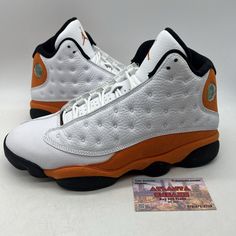 Own the basketball court with these size 9.5 Air Jordan 13 Retro sneakers. The starfish white, orange, and black suede design is sure to turn heads on and off the court. These athletic shoes are made with high-quality leather for durability and comfort. The Air Jordan 13 Retro model is a must-have for any sneaker enthusiast and this particular pair is a 2021 release. They are suitable for men and are perfect for any athletic activity. Add these sneakers to your collection today and experience the superior design and craftsmanship. No box High-top Jordan Shoes For Sports, Jordan Basketball Shoes With Branded Insole, Mid-top Jordan Shoes For Sports Events, Jordan High-top Shoes With Boost Midsole For Sports, Jordan Basketball Shoes With Round Toe, High-top Synthetic Jordan Basketball Shoes, Synthetic Jordan Basketball Shoes, Synthetic Round Toe Jordan Basketball Shoes, Synthetic Round Toe Jordan Shoes For Basketball